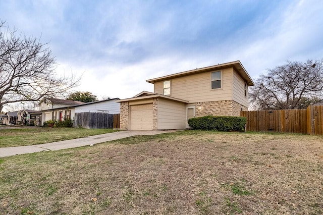 front facade with a garage and a front lawn