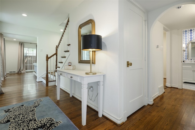 corridor with dark hardwood / wood-style floors