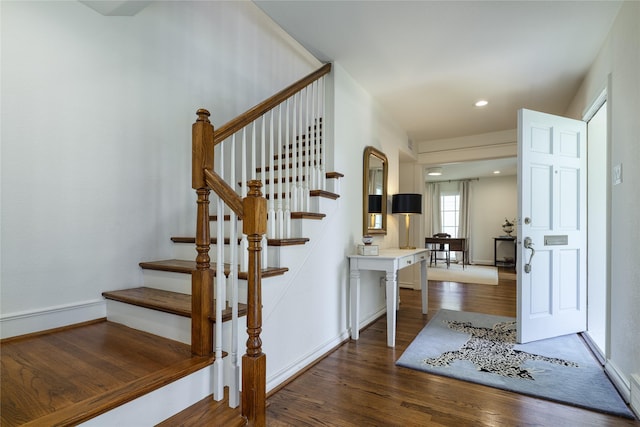 stairway featuring hardwood / wood-style floors