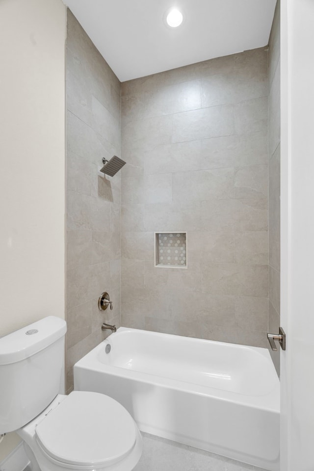 bathroom with shower / washtub combination and toilet