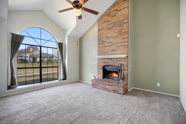 unfurnished living room featuring ceiling fan, carpet floors, high vaulted ceiling, and a brick fireplace