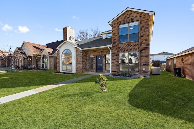 exterior space with a front yard and central air condition unit