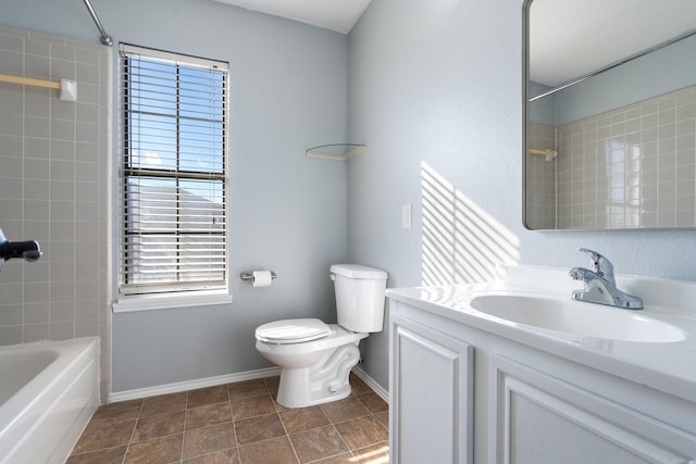 full bathroom featuring vanity, toilet, and tiled shower / bath