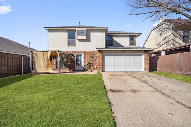 rear view of property featuring a lawn and a garage