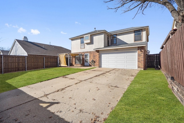 view of property featuring a front lawn and a garage