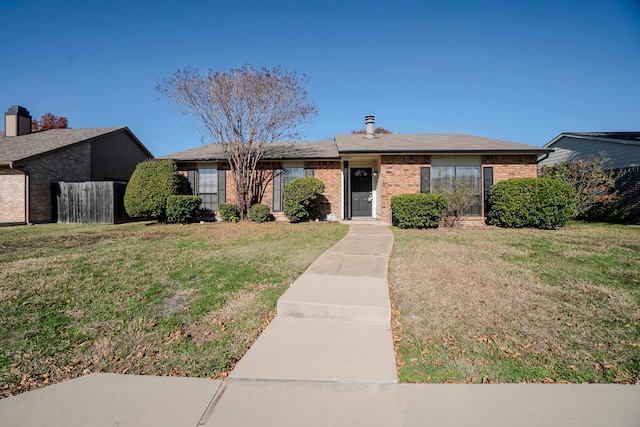 single story home featuring a front yard