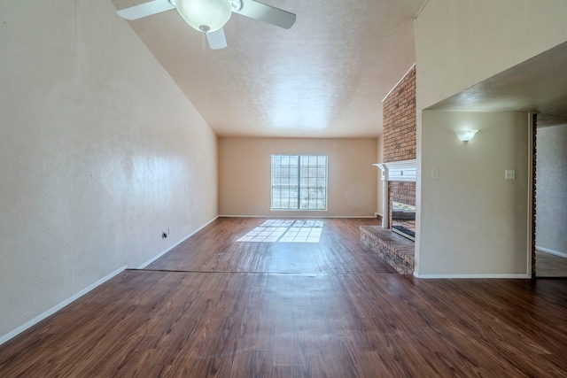 unfurnished living room with ceiling fan, dark hardwood / wood-style flooring, and a fireplace