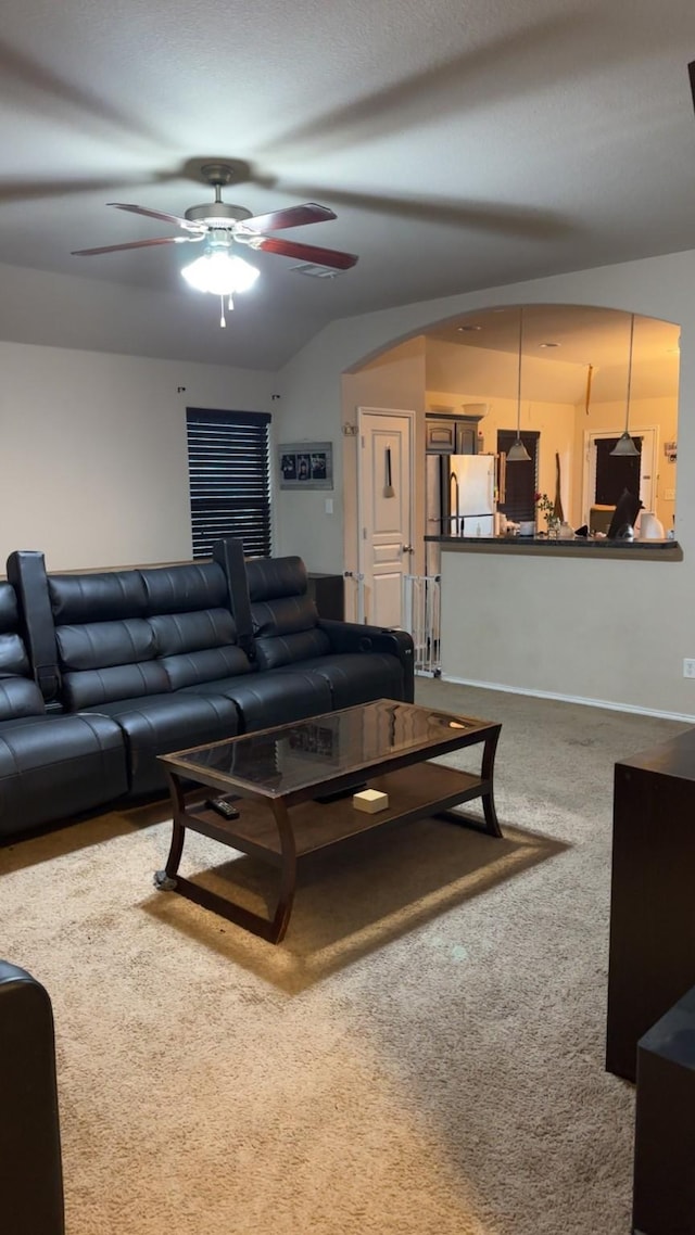 carpeted living room featuring ceiling fan