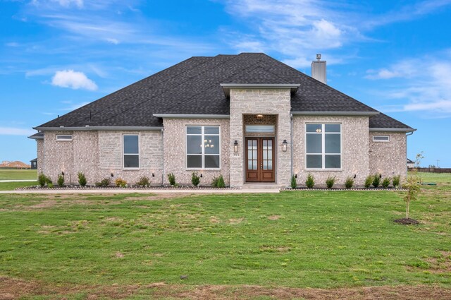 571 N Armstrong Rd, Venus, TX 76084 - prairie-style home featuring a front yard, roof with shingles, french doors, a chimney, and brick siding