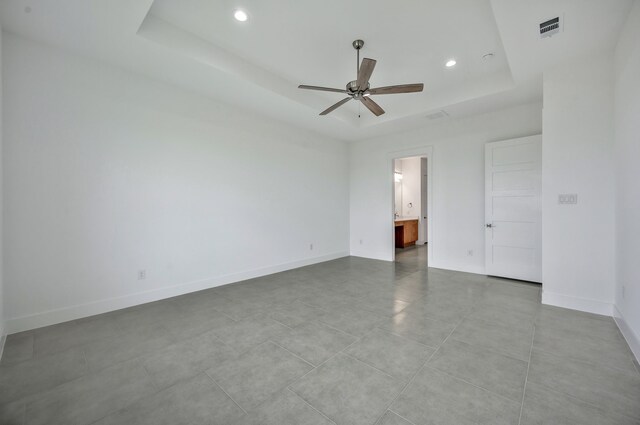 571 N Armstrong Rd, Venus, TX 76084 - unfurnished bedroom with ensuite bath, recessed lighting, baseboards, a tray ceiling, and visible vents