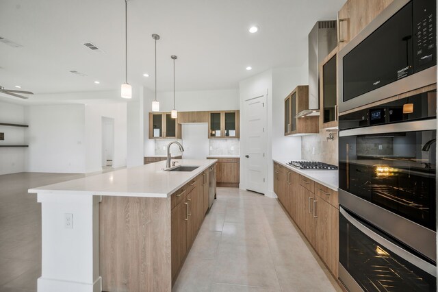 571 N Armstrong Rd, Venus, TX 76084 - kitchen with a sink, brown cabinetry, stainless steel appliances, backsplash, and modern cabinets
