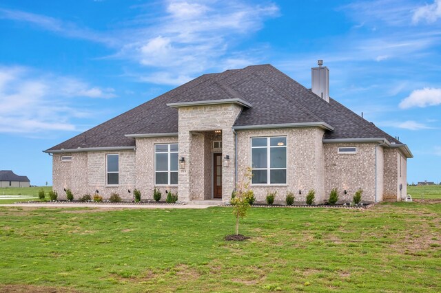 571 N Armstrong Rd, Venus, TX 76084 - view of front of property featuring brick siding, a chimney, a shingled roof, and a front lawn