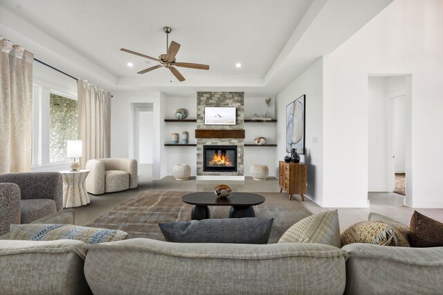 571 N Armstrong Rd, Venus, TX 76084 - living area with built in features, a fireplace, recessed lighting, a raised ceiling, and a ceiling fan
