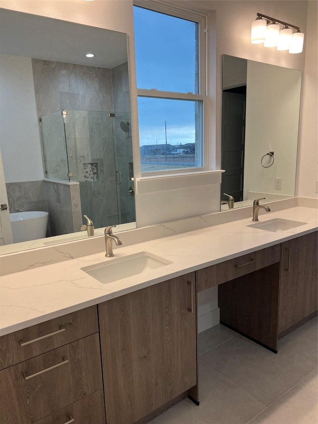 bathroom with tile patterned flooring, vanity, and independent shower and bath