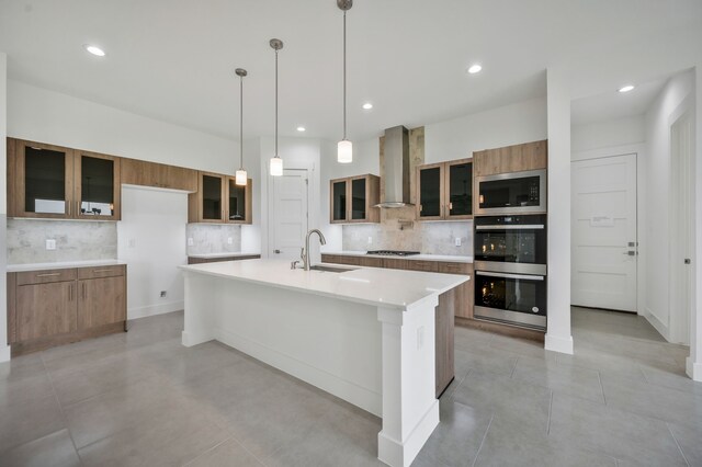 571 N Armstrong Rd, Venus, TX 76084 - kitchen with wall chimney range hood, a sink, stainless steel appliances, decorative backsplash, and modern cabinets