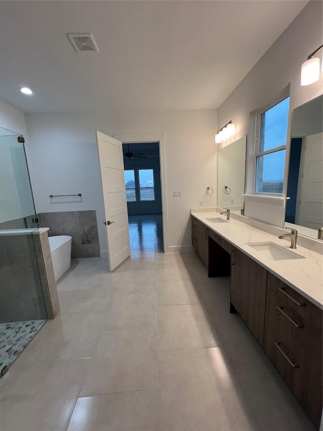 bathroom with plus walk in shower and vanity