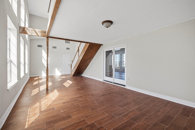 interior space with a healthy amount of sunlight and a textured ceiling