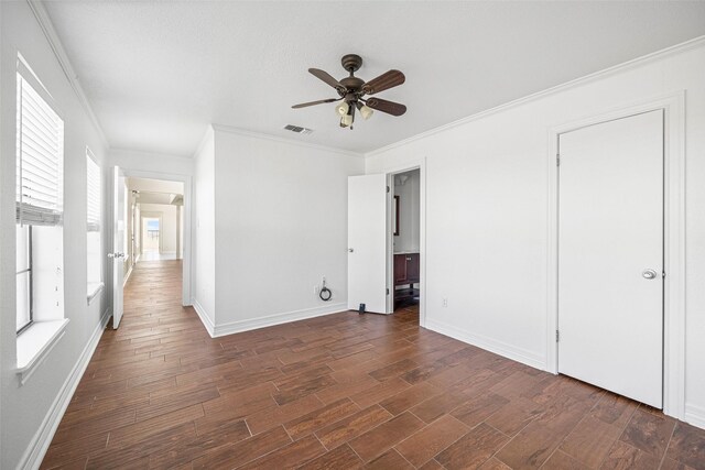 unfurnished bedroom featuring ceiling fan and crown molding