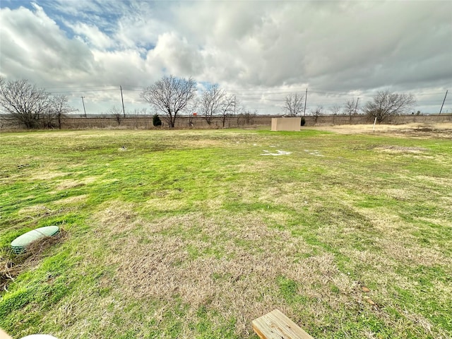 view of yard with a rural view