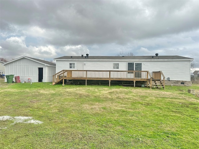 back of house featuring a lawn and a wooden deck