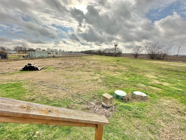 view of yard with a rural view