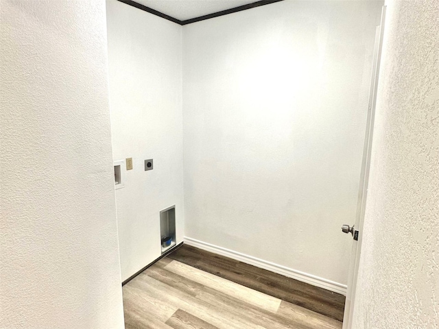 washroom with washer hookup, hardwood / wood-style floors, crown molding, and electric dryer hookup