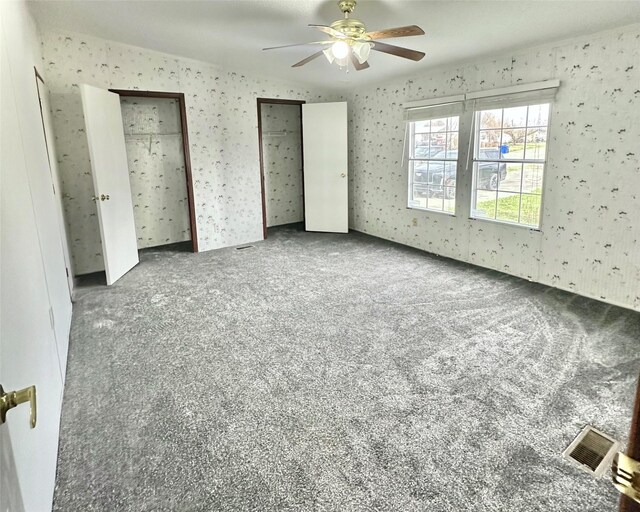 unfurnished bedroom with carpet flooring and ceiling fan