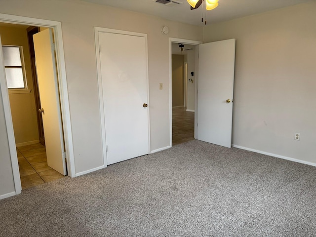 unfurnished bedroom with carpet floors