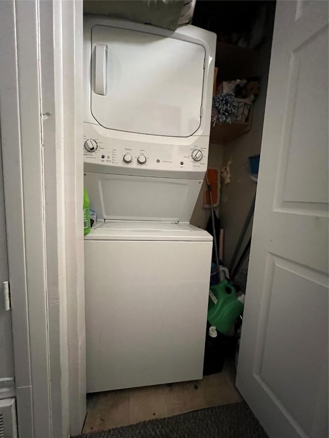 washroom featuring stacked washer and dryer