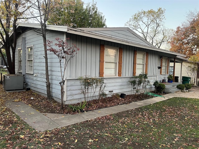 view of side of home featuring central air condition unit