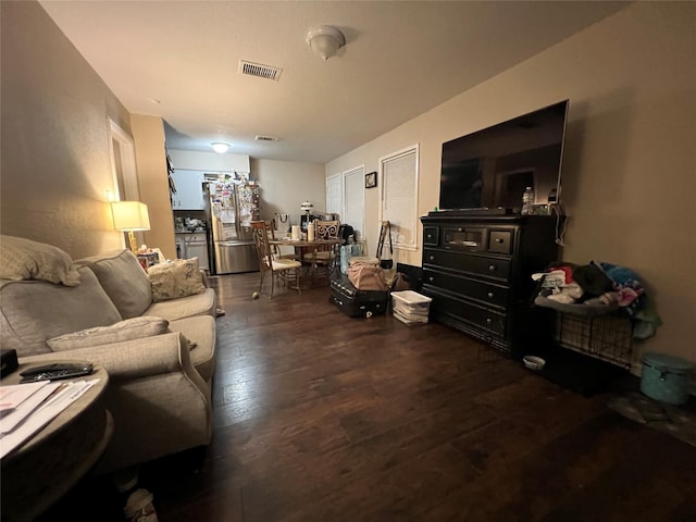 living room featuring dark hardwood / wood-style floors