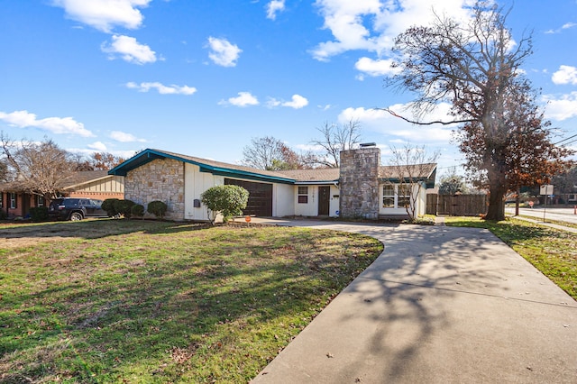 single story home with a front yard and a garage