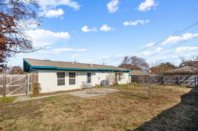 back of property with a yard and cooling unit