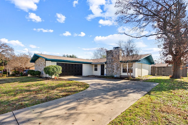 single story home with a garage and a front yard