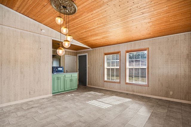 interior space featuring wood walls, wooden ceiling, and lofted ceiling