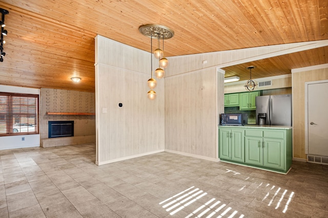 unfurnished living room featuring lofted ceiling, a large fireplace, and wooden ceiling