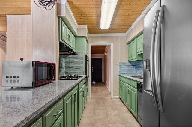 kitchen featuring light stone countertops, tasteful backsplash, stainless steel fridge, wood ceiling, and green cabinetry