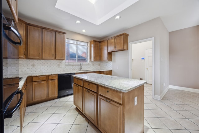 kitchen with sink, light tile patterned floors, black dishwasher, light stone counters, and a kitchen island