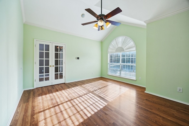 spare room with ceiling fan, french doors, dark wood-type flooring, crown molding, and vaulted ceiling