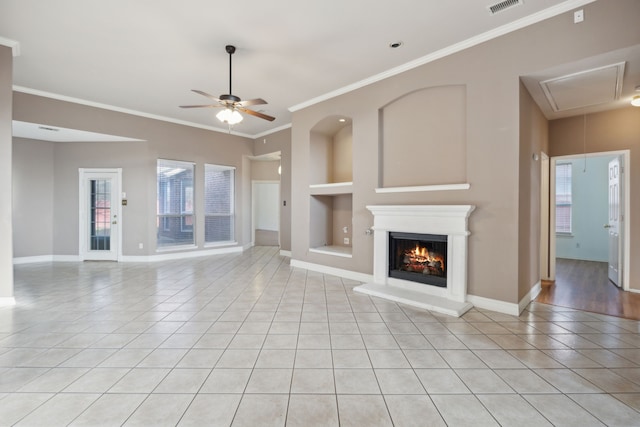 unfurnished living room with built in shelves, light tile patterned floors, ceiling fan, and ornamental molding