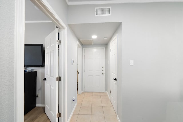 hall with light tile patterned flooring