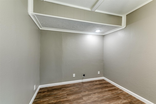 spare room featuring hardwood / wood-style floors and ornamental molding