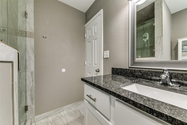 bathroom featuring vanity and a shower with shower door