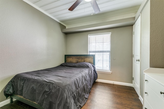 bedroom with ceiling fan and dark hardwood / wood-style flooring