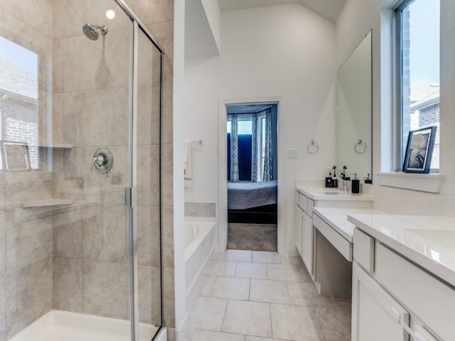 bathroom featuring vanity, shower with separate bathtub, and a wealth of natural light