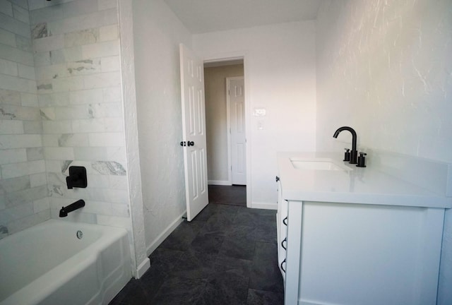 bathroom with vanity and tiled shower / bath combo