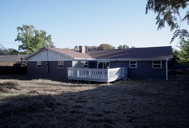 back of house with a deck