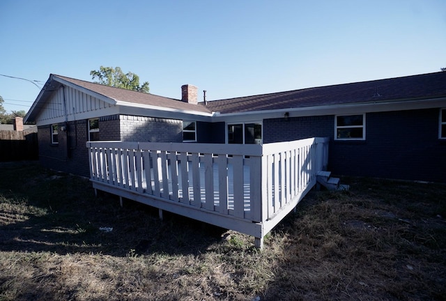 rear view of house featuring a deck