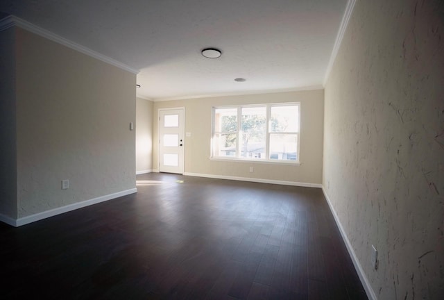 empty room with dark hardwood / wood-style floors and ornamental molding