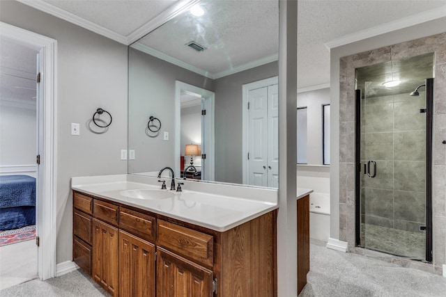 bathroom featuring a textured ceiling, vanity, walk in shower, and crown molding